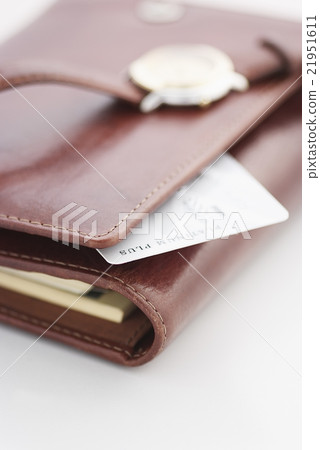 Credit card and a watch on a agenda 21951611