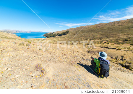 Tourist looking at view from above, Titicaca Lake, Bolivia 21959044