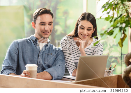Nice colleagues sitting at the table  21964380
