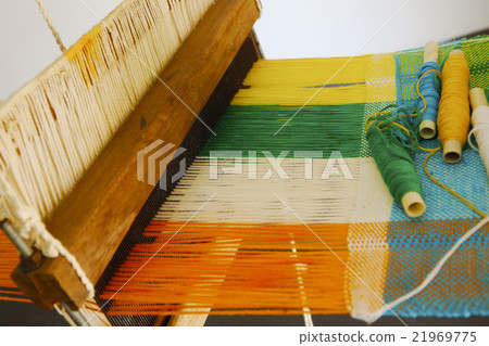 Vintage manual weaving loom with textile 21969775