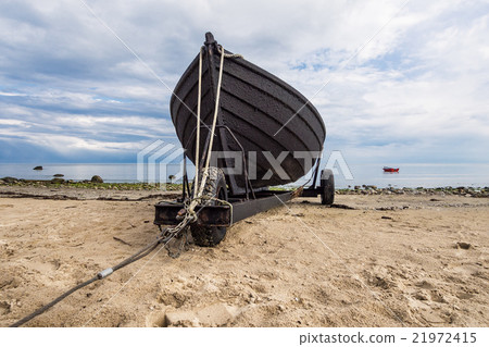 Fishing boat on shore of the Baltic Sea Fishing boat on shore of the Baltic Sea 21972415