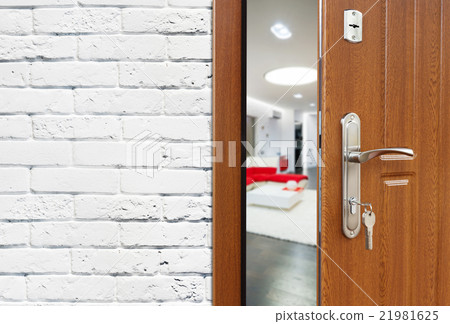 Half open door of a modern living room closeup. Half open door of a modern living room closeup. 21981625
