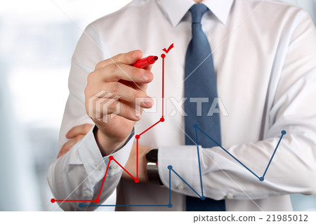 Young business man drawing a graphs by red pen Young business man drawing a graphs by red pen 21985012