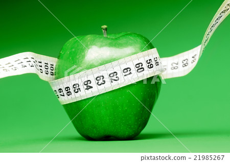 Delicious apple with measuring tape 21985267