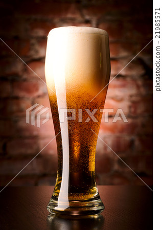 glass of lager on table glass of lager on table 21985571