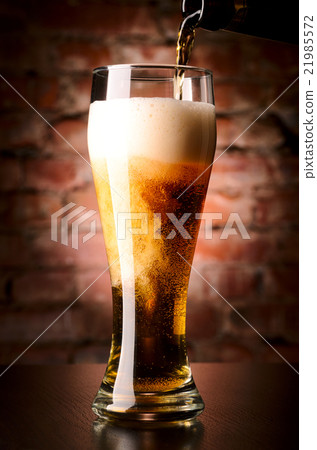 glass of lager on table glass of lager on table 21985572