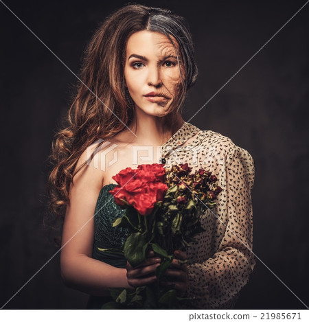 Aging skin concept. Half old half young woman Aging skin concept. Half old half young woman 21985671