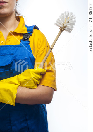 Woman holds toilet brush 21986156