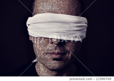 young man with a blindfold in his eyes young man with a blindfold in his eyes 21990789