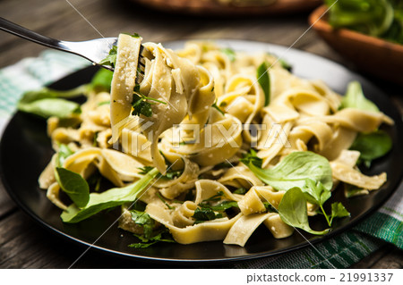 Cooked tagliatelle on a plate Cooked tagliatelle on a plate 21991337