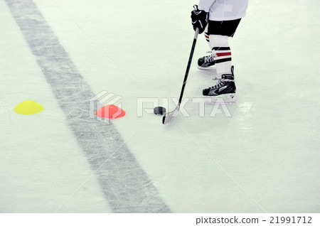 hockey player with the puck on training 21991712