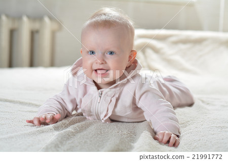 little cute girl in a bathrobe a white 21991772