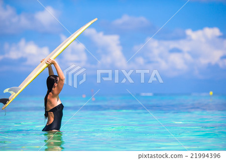 Beautiful surfer woman surfing during summer 21994396