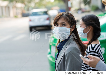 Woman in face mask Woman in face mask 21994691