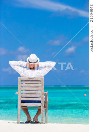 Young man enjoying summer vacation on tropical 21994948