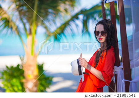 Young beautiful woman on tropical beach vacation 21995541