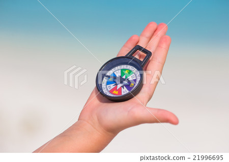 Little girl traveler with a compass in the hand on Little girl traveler with a compass in the hand on 21996695
