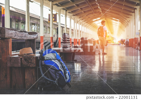 Traveler's bag at a train station Traveler's bag at a train station 22001131