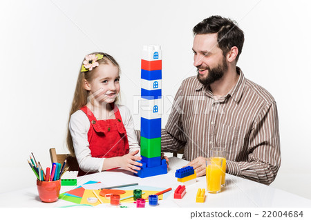 Father and daughter playing educational games Father and daughter playing educational games 22004684