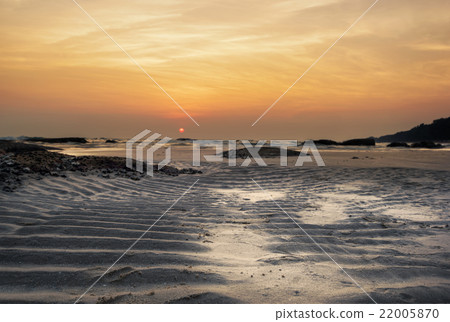 Sand dunes against the sunset light on the beach 22005870