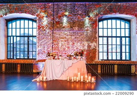 Table set for banquet in loft. Vintage room. 22009290