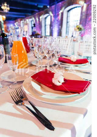 Table set for banquet with cutlery. Table set for banquet with cutlery. 22009292