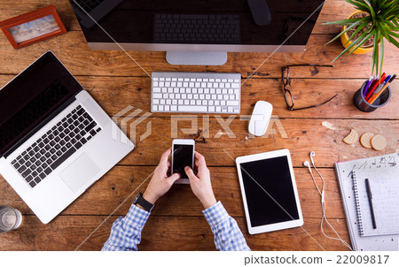Business person working at office desk wearing 22009817