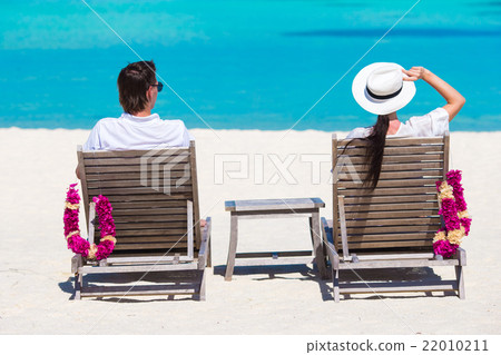 Young happy couple during beach tropical vacation Young happy couple during beach tropical vacation 22010211