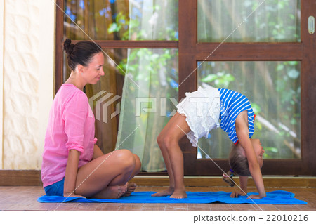 Young woman and little girl engaged in fitness 22010216