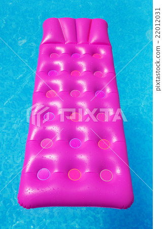 Pink air mattress in swimming pool. Holiday Pink air mattress in swimming pool. Holiday 22012031