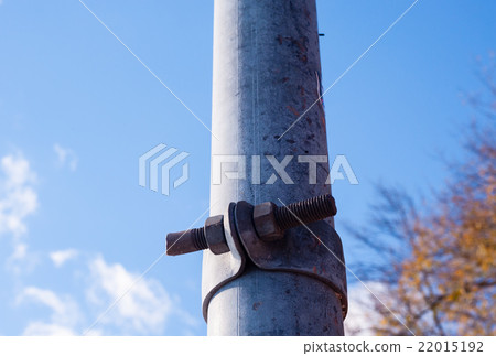 Dirty metal pole with rusted fastener. Dirty metal pole with rusted fastener. 22015192