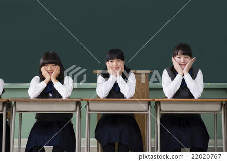 Girls girls sitting in a row with desks Girls girls sitting in a row with desks 22020767