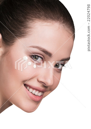 Girl with cream dots on face 22024798