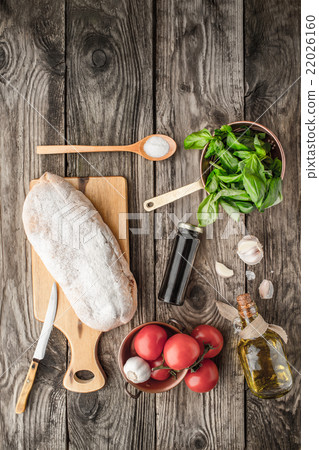 Ingredients for bruschetta on the wooden table Ingredients for bruschetta on the wooden table 22026160