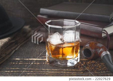 Whiskey with pipe , hat and newspaper Whiskey with pipe , hat and newspaper 22027629