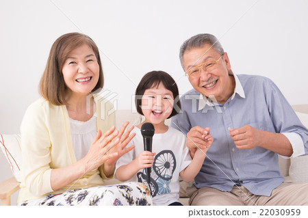 Senior couple and granddaughter (karaoke) Senior couple and granddaughter (karaoke) 22030959