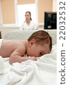 Newborn baby lying on the table in doctor's office 22032532