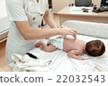Pediatrician examining littlle newborn baby 22032543