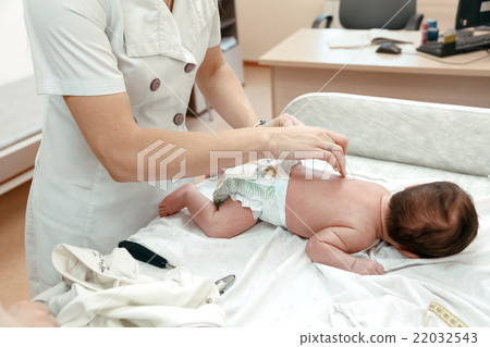 Pediatrician examining littlle newborn baby Pediatrician examining littlle newborn baby 22032543