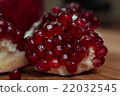 Several pieces of juicy pomegranate 22032545