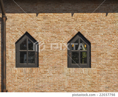 red brick wall and dark brown painted wood window red brick wall and dark brown painted wood window 22037798