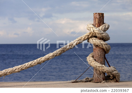 Rope on seafront and cloudy sky in autumn 22039367
