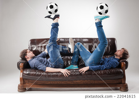 The two guys with balls on gray background The two guys with balls on gray background 22041615