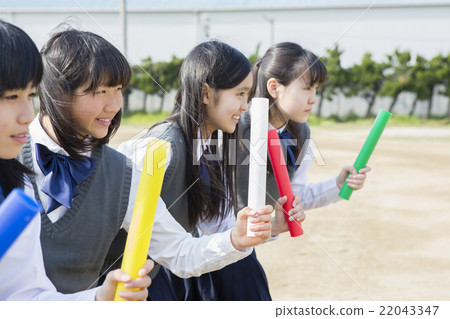 Female student with baton Female student with baton 22043347
