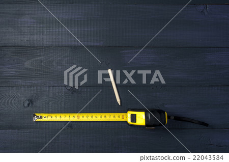 Yellow roulette and pencil on wooden boards Yellow roulette and pencil on wooden boards 22043584