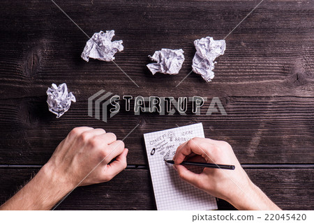 Office desk with start up sign, unrecognizable man Office desk with start up sign, unrecognizable man 22045420