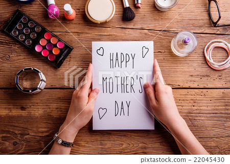 Mothers day composition. Greeting card and make up Mothers day composition. Greeting card and make up 22045430