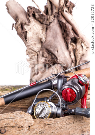 fishing tackles and fishing baits on wooden 22053728