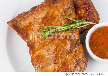 hot smoked barbecue ribs on white plate hot smoked barbecue ribs on white plate 22053762