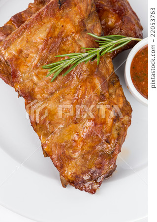 hot smoked barbecue ribs on white plate 22053763